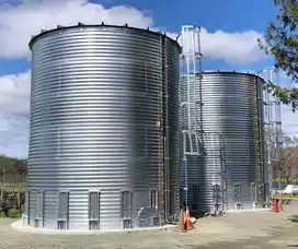 Two corrugated steel tanks side by side