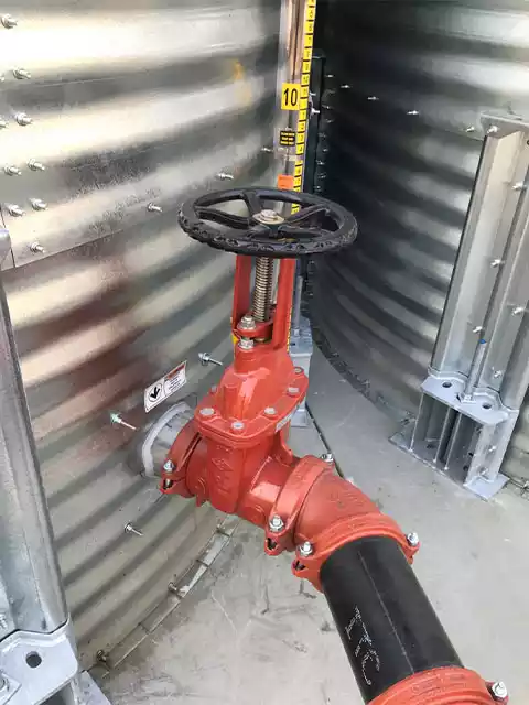 Fitting leading to a pipe on a corrugated steel tank