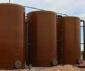 3 firberglass tanks side by side for liquid storage